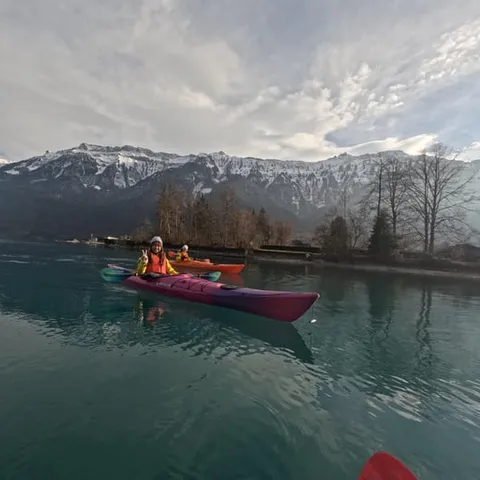 A kayak on Lake Brienz below the mountains