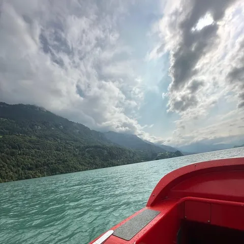 The bow of the jetboat on the turquoise water of Lake Brienz